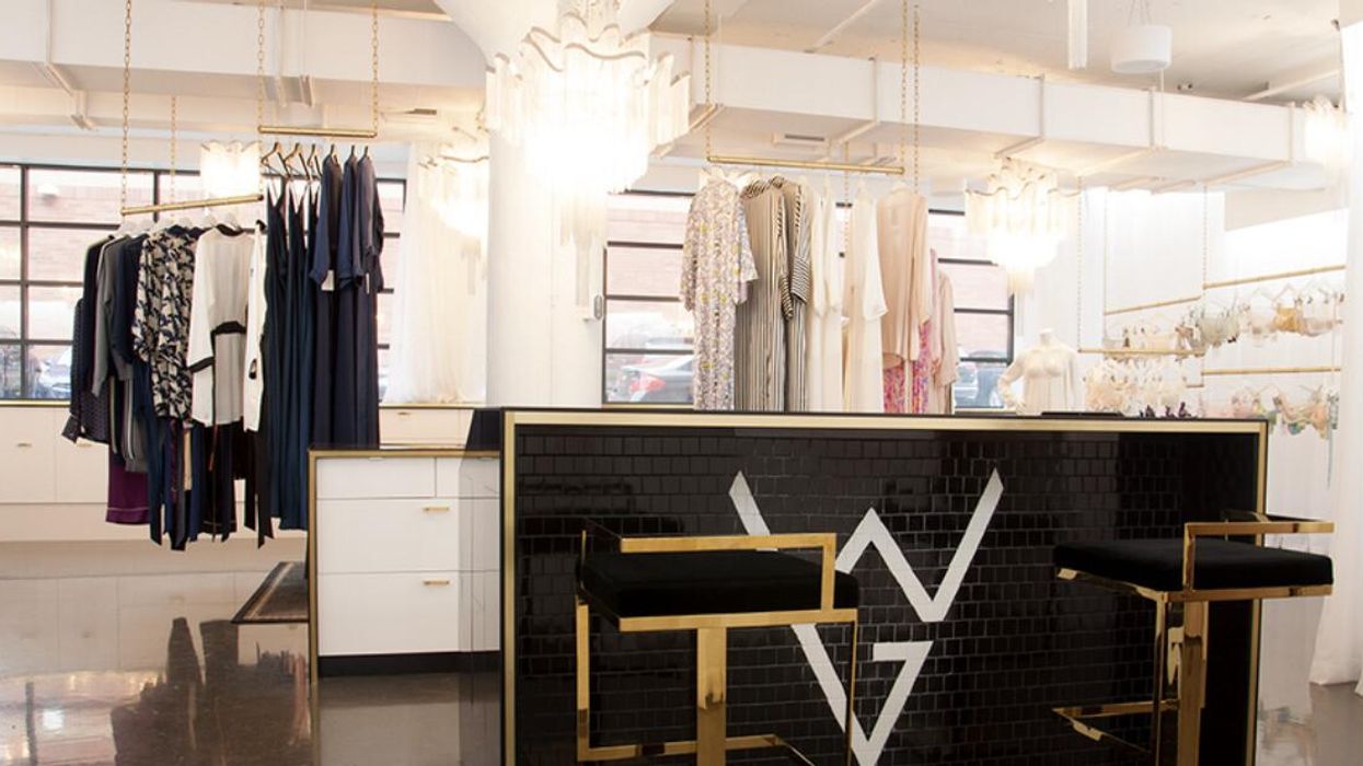 A tiled counter at Workingirls Boutique with gold and black stools surrounded by lingerie.