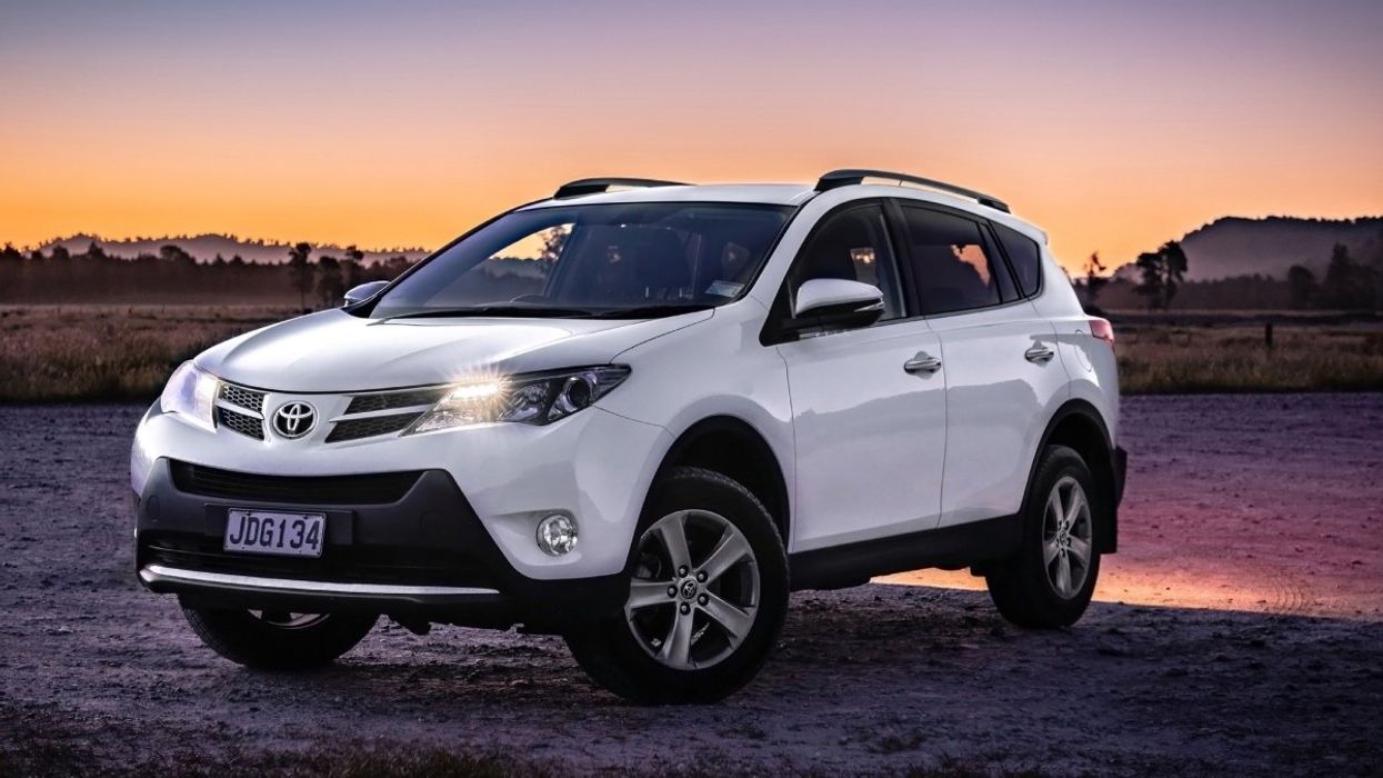 A Toyota RAV4 on terrain at sunset.