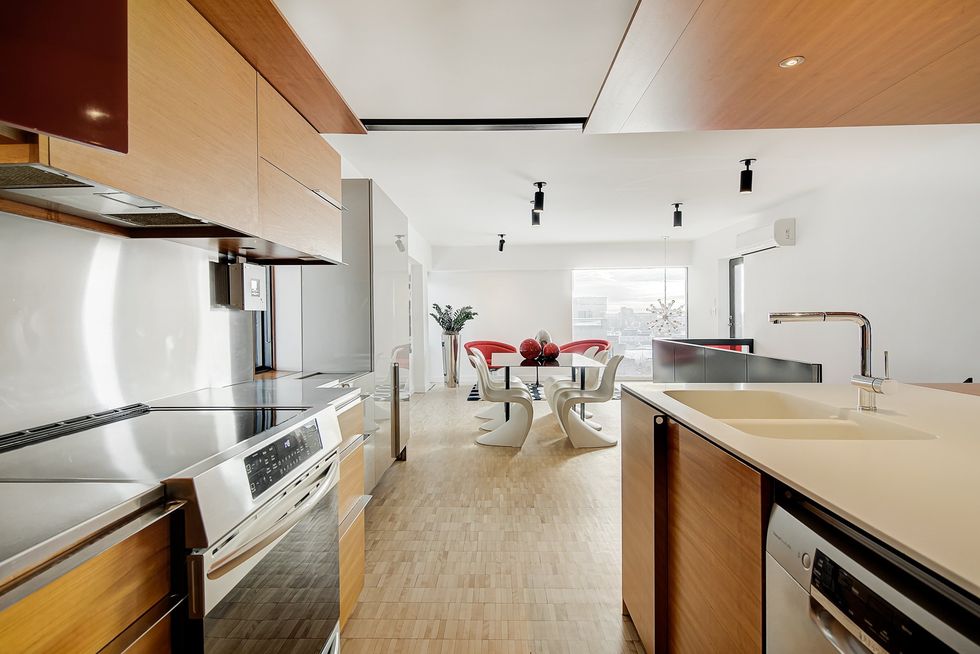 A view from the kitchen to the dining area.