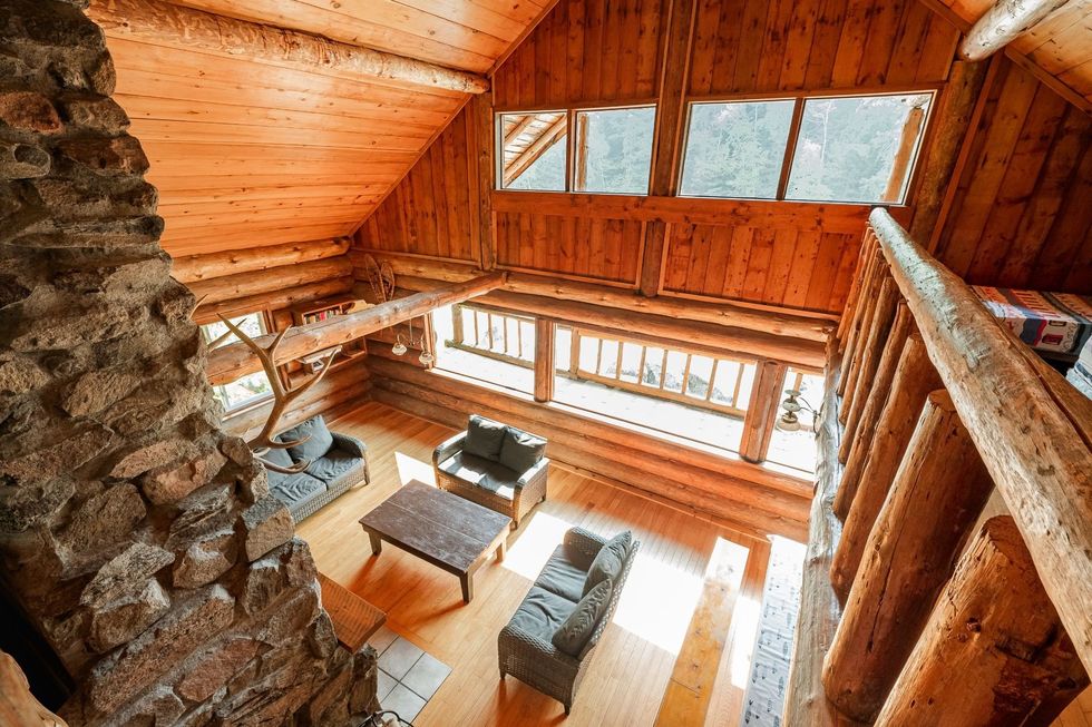 A view of the living area of the red pine cabin from the second floor.
