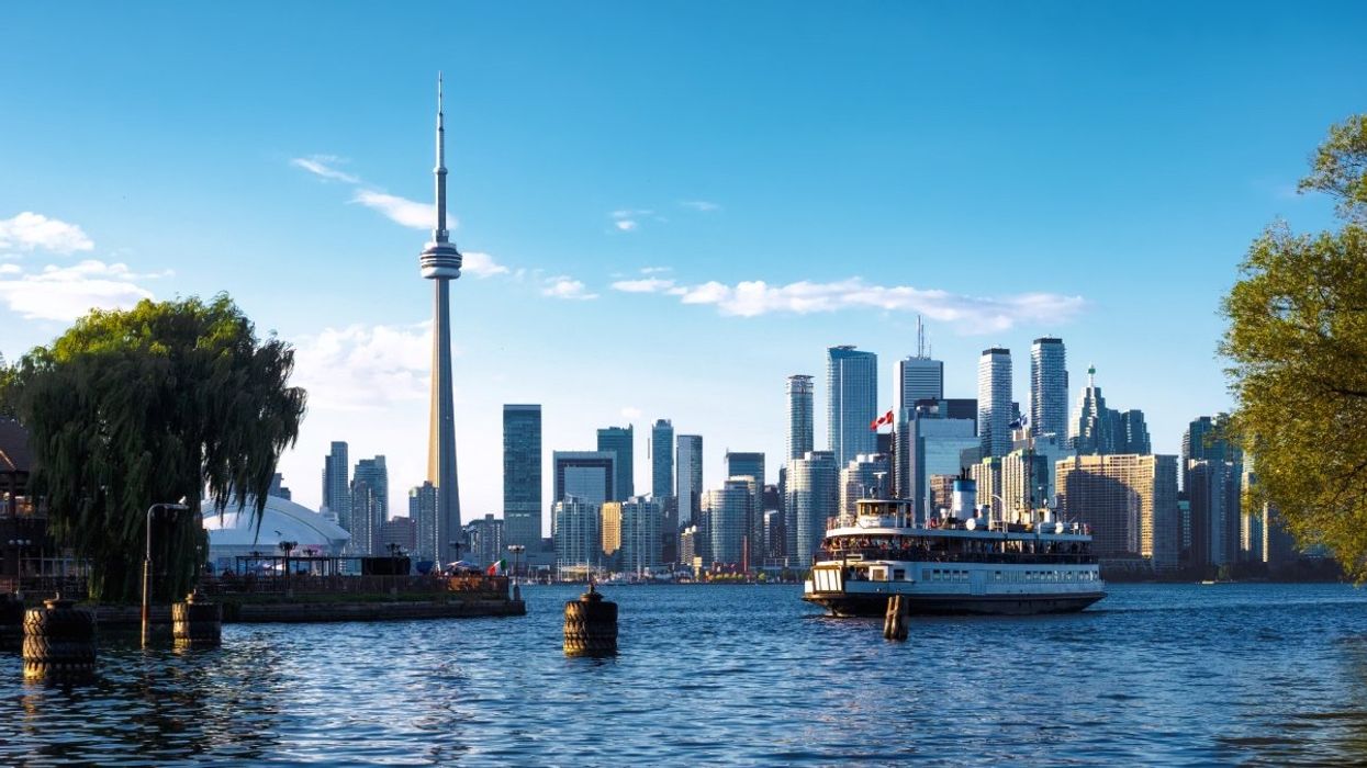 A view of the Toronto skyline, the CN Tower and the ferry from Toronto Islands.