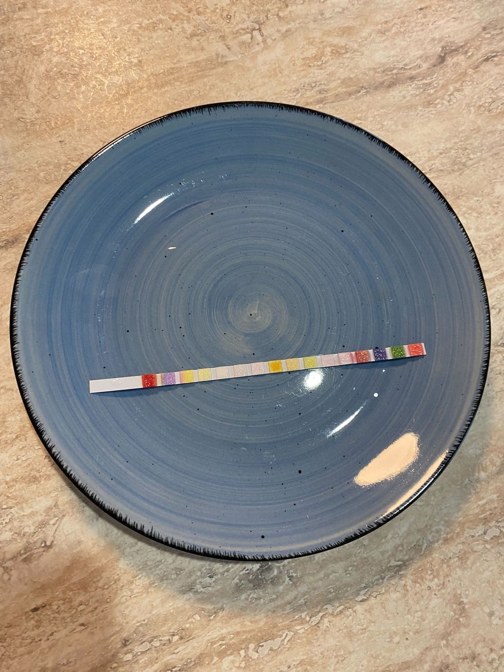 A water test strip in a plate.