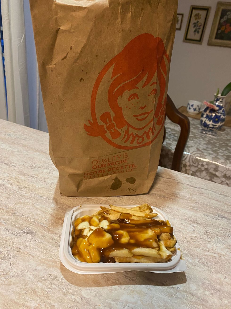 A Wendy's poutine on a kitchen counter.