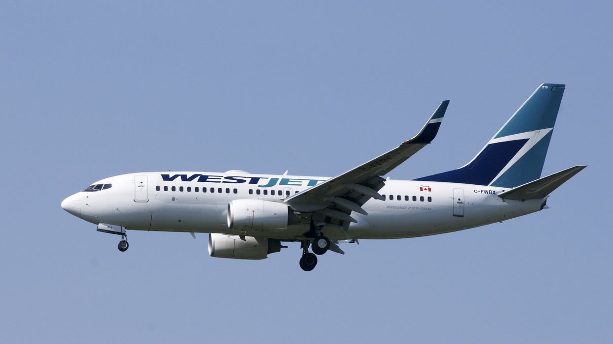 A WestJet plane in flight (illustrative).