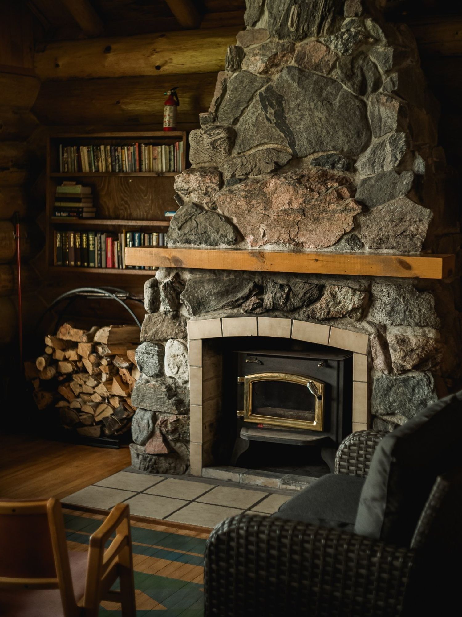 A wood-burning fireplace made with river stones.