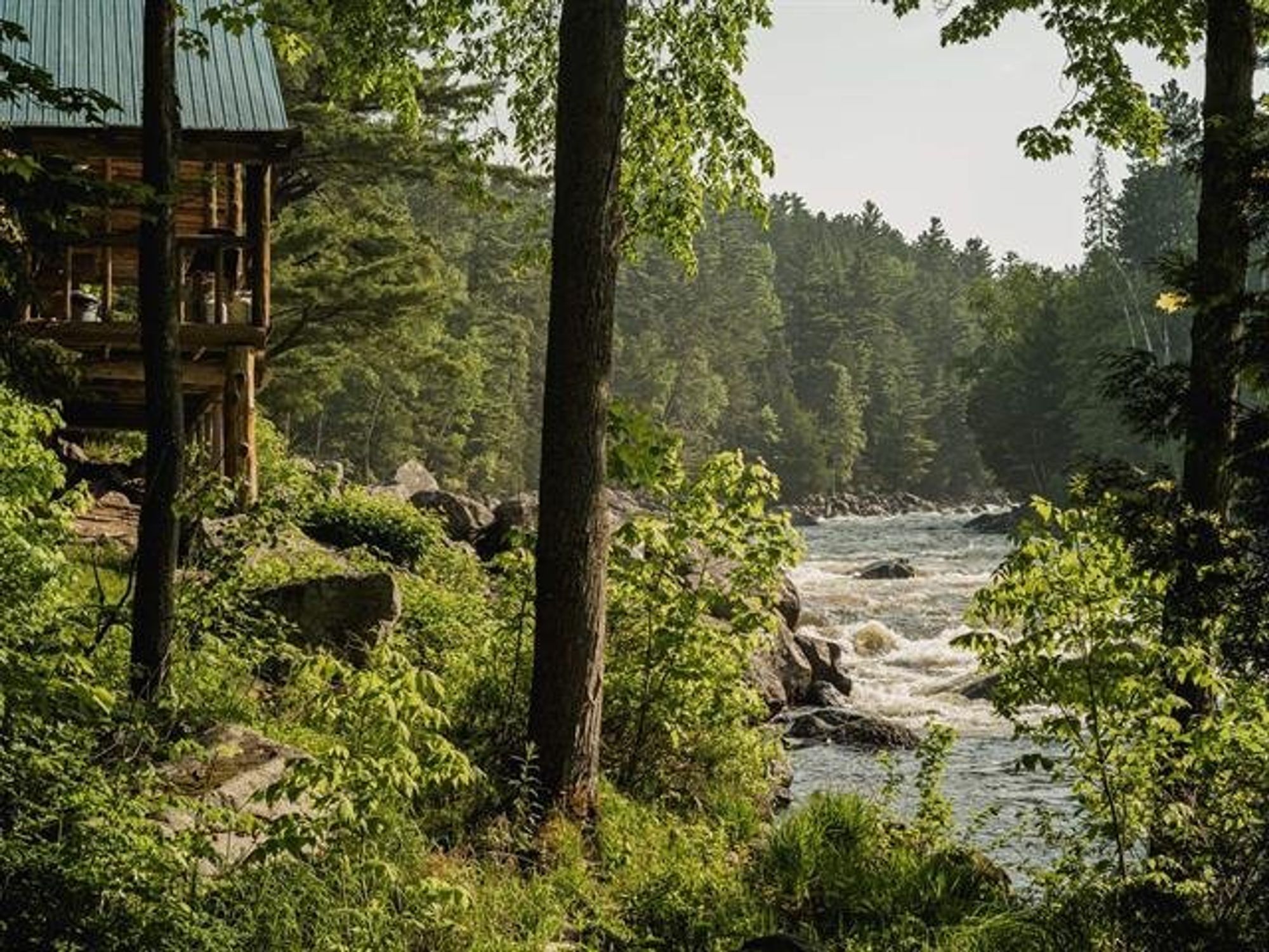 A wraparound deck overlooking the river.