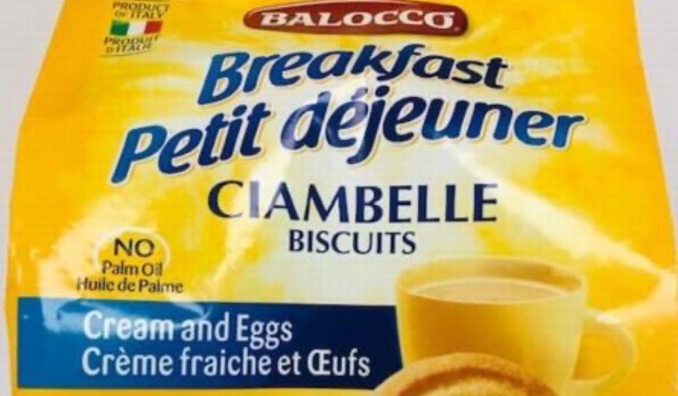 A yellow bag of Balocco brand Ciambelle biscuits with a cup of coffee on the bag's packaging.