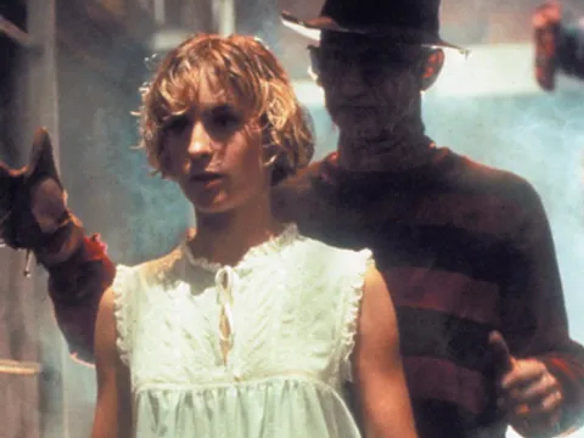 Actress Amanda Wyss and Rob Englund in the background.