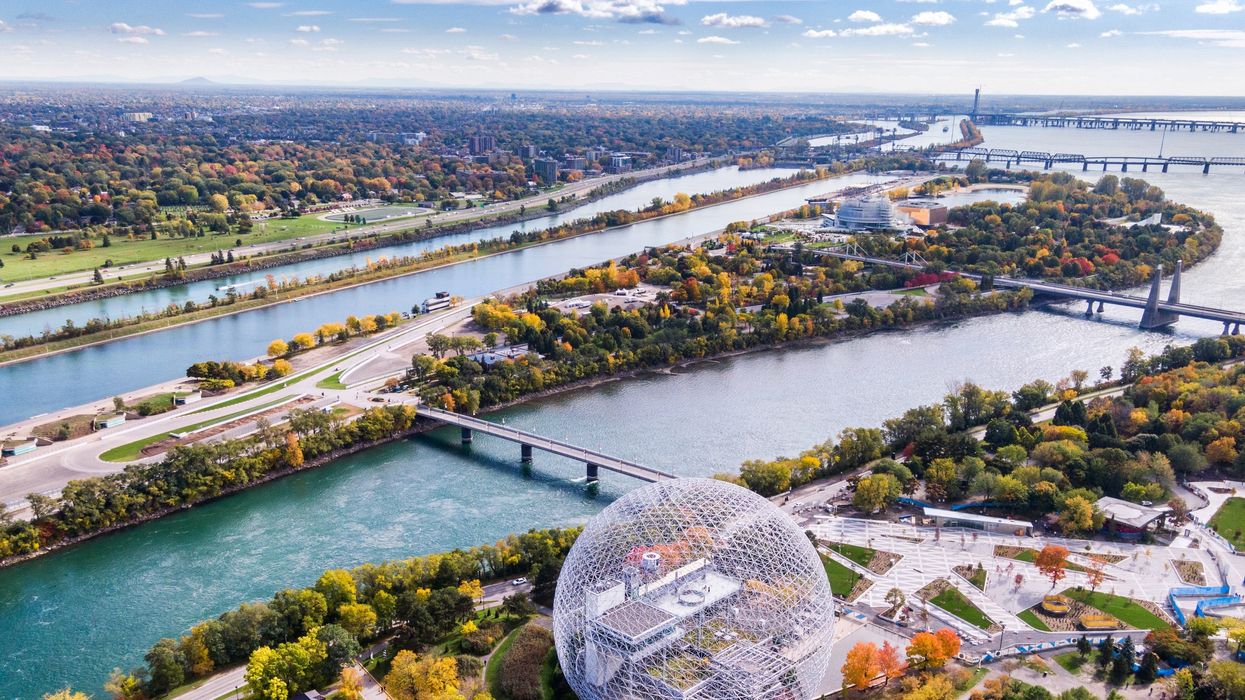 Aerial view of Montreal with fall colours and sunny skies.