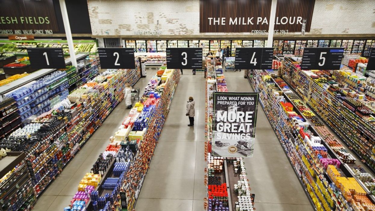 An aerial view of a Canadian grocery store with various people shopping in different aisles.