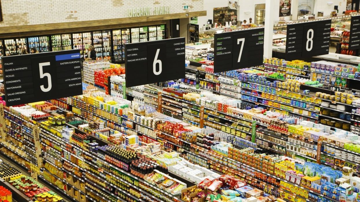 An aerial views of grocery aisles stocked with food products at a store in Canada.