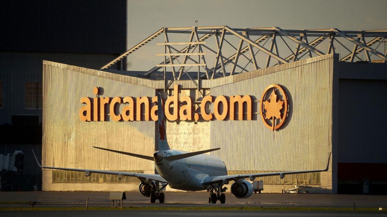 An Air Canada plane is grounded outside the company's hanger at Trudeau Airport in Montreal.