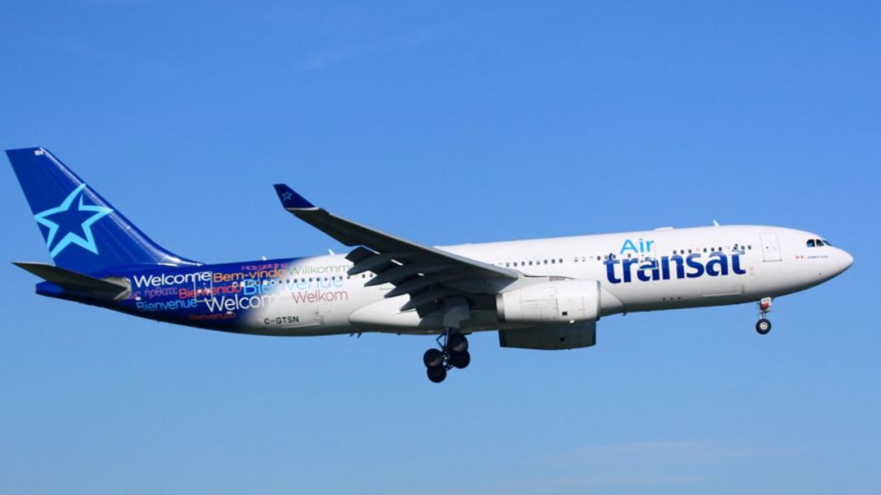 An Air Transat plane in the sky.