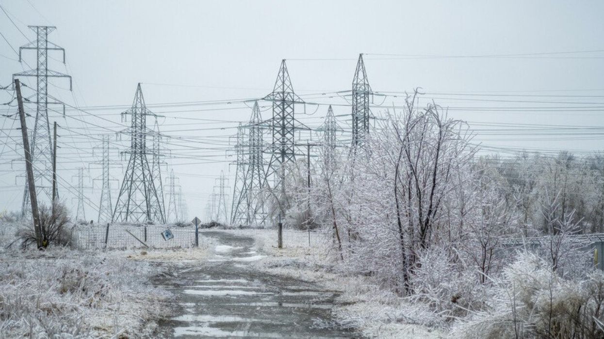 An electrical power field covered in freezing rain.