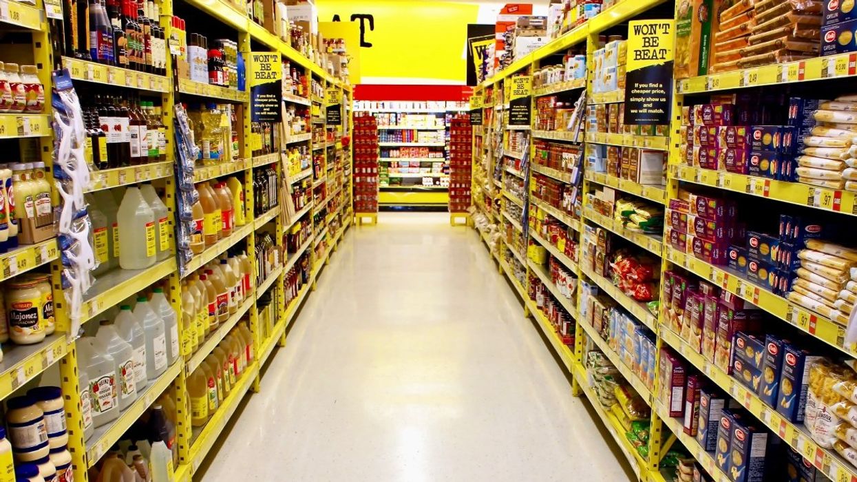 An empty grocery store aisle in Canada.