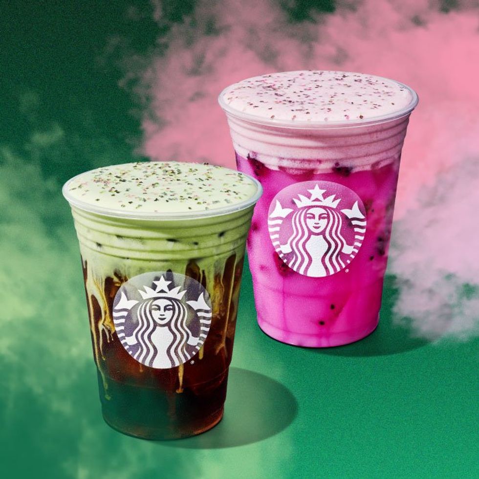 An iced coffee beverage with green foam and a bright pink iced beverage, both in Starbucks cups.