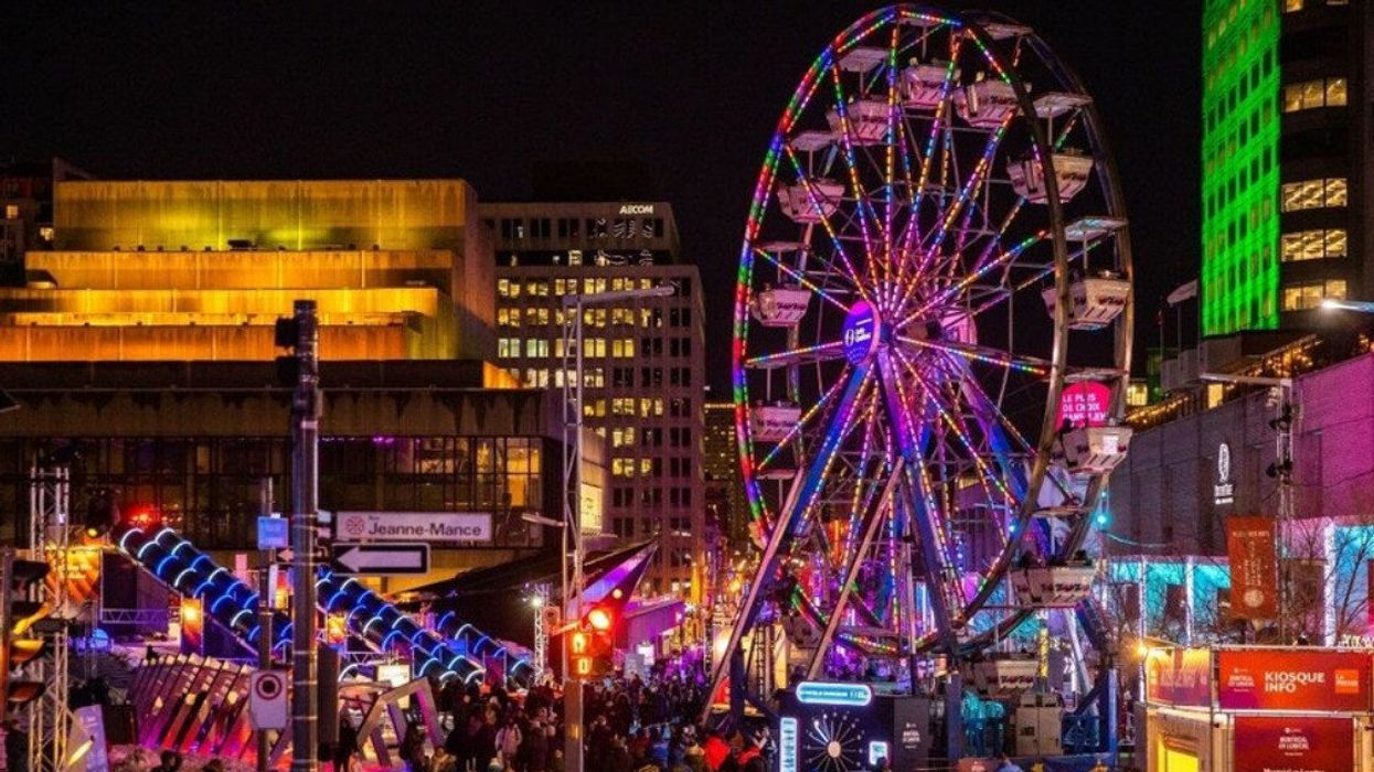 An illuminated ferris wheel in Montreal's Quartier des Spectacles.