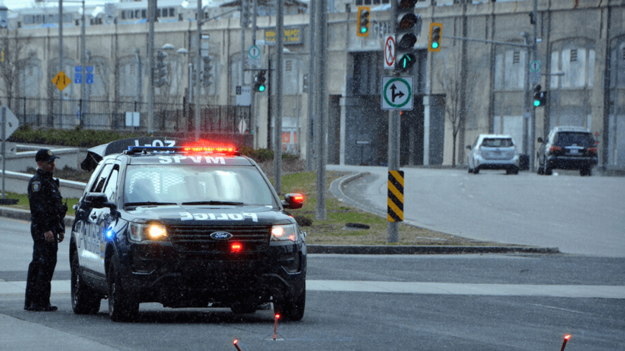 An SPVM vehicle stopped on the road.