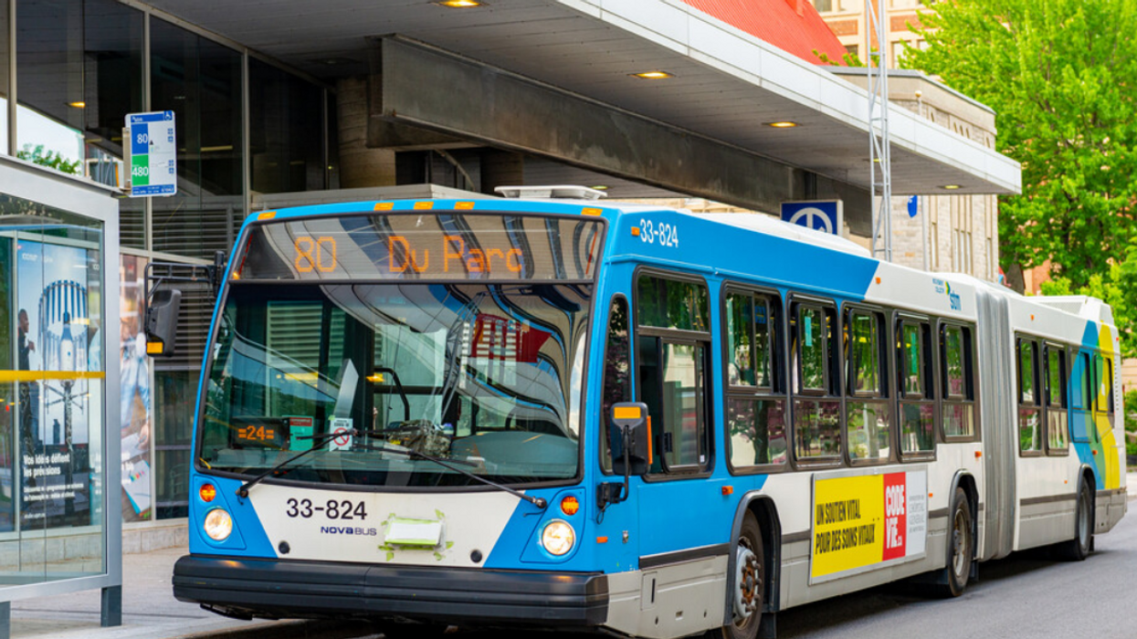 An STM 80 bus stops at Places des Arts station.