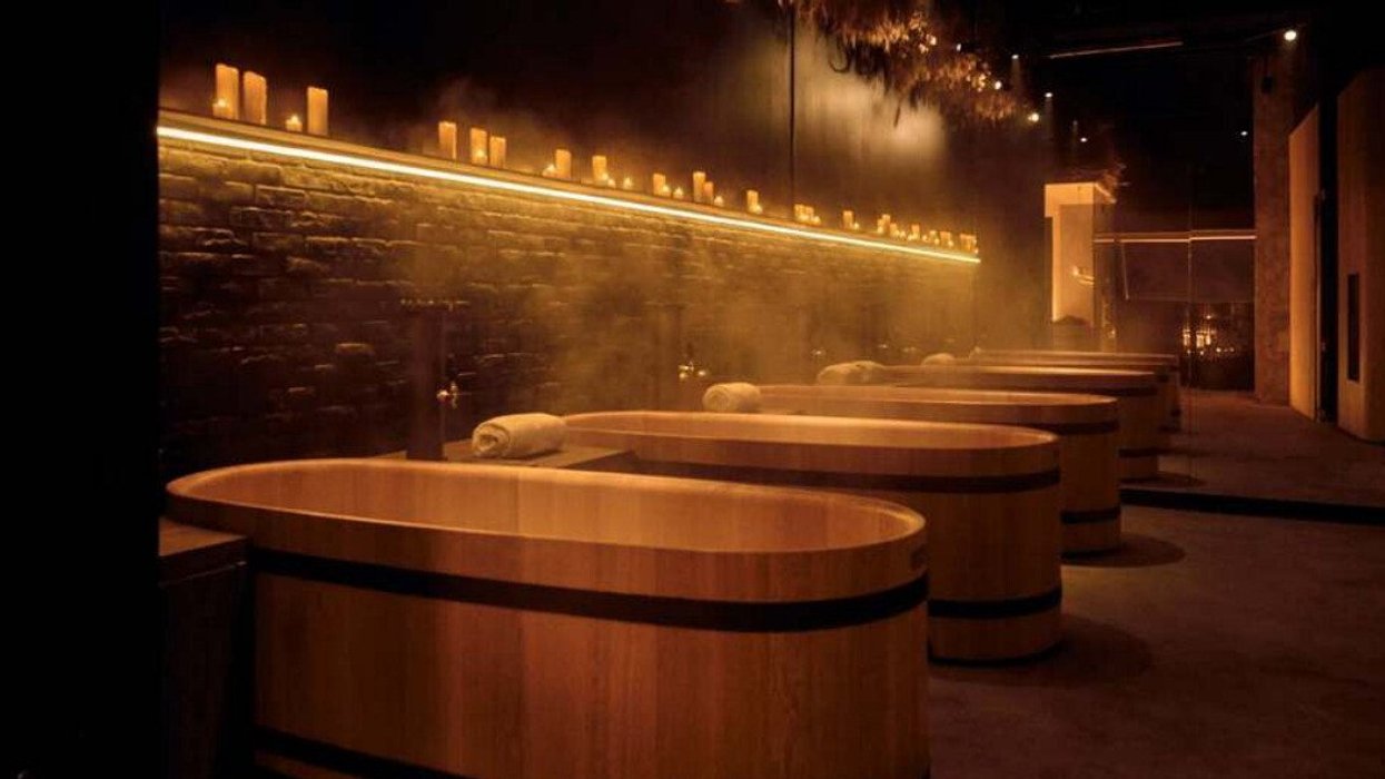 Baths in a candlelit spa.