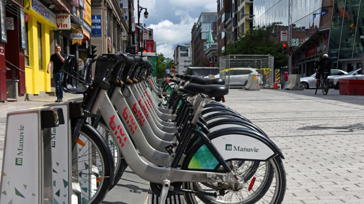 Bixi bikes stand on Saint Catherine Street.