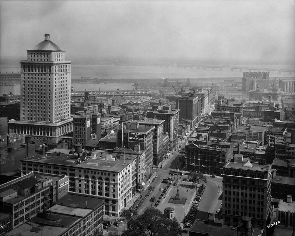 Black and white image of Old Montreal in 1937, the Royal Bank Tower stands much taller than the surrounding buildings at 22 stories.