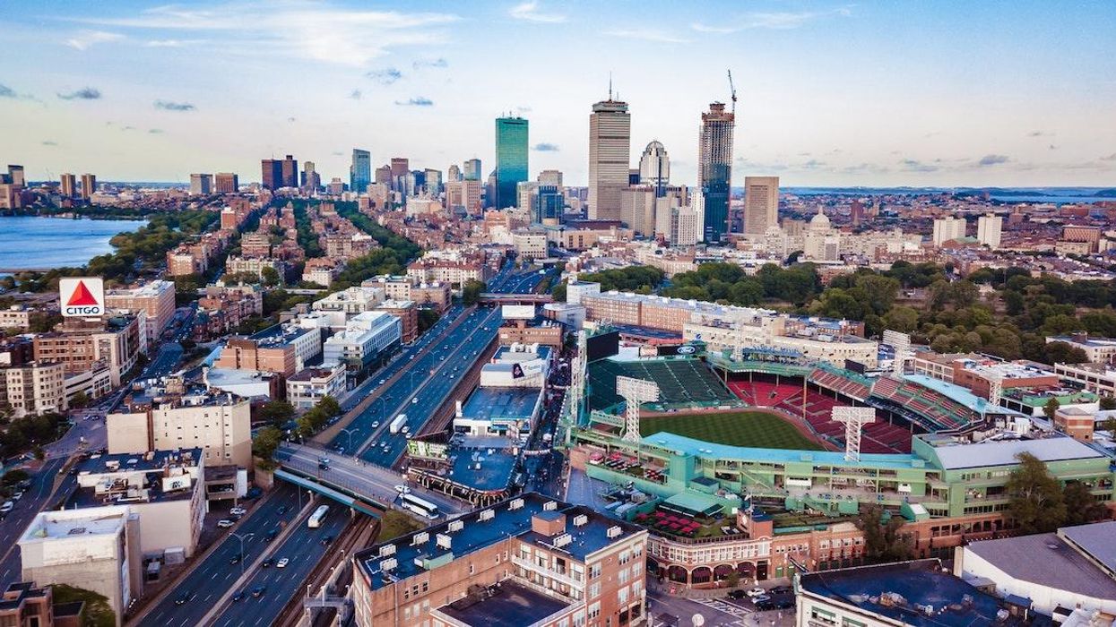 Boston skyline with Fenway park in the foreground.
