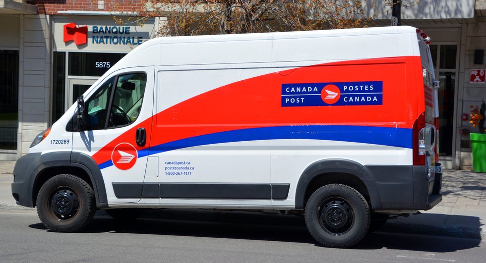 Canada Post van outside a Banque Nationale in Montreal.
