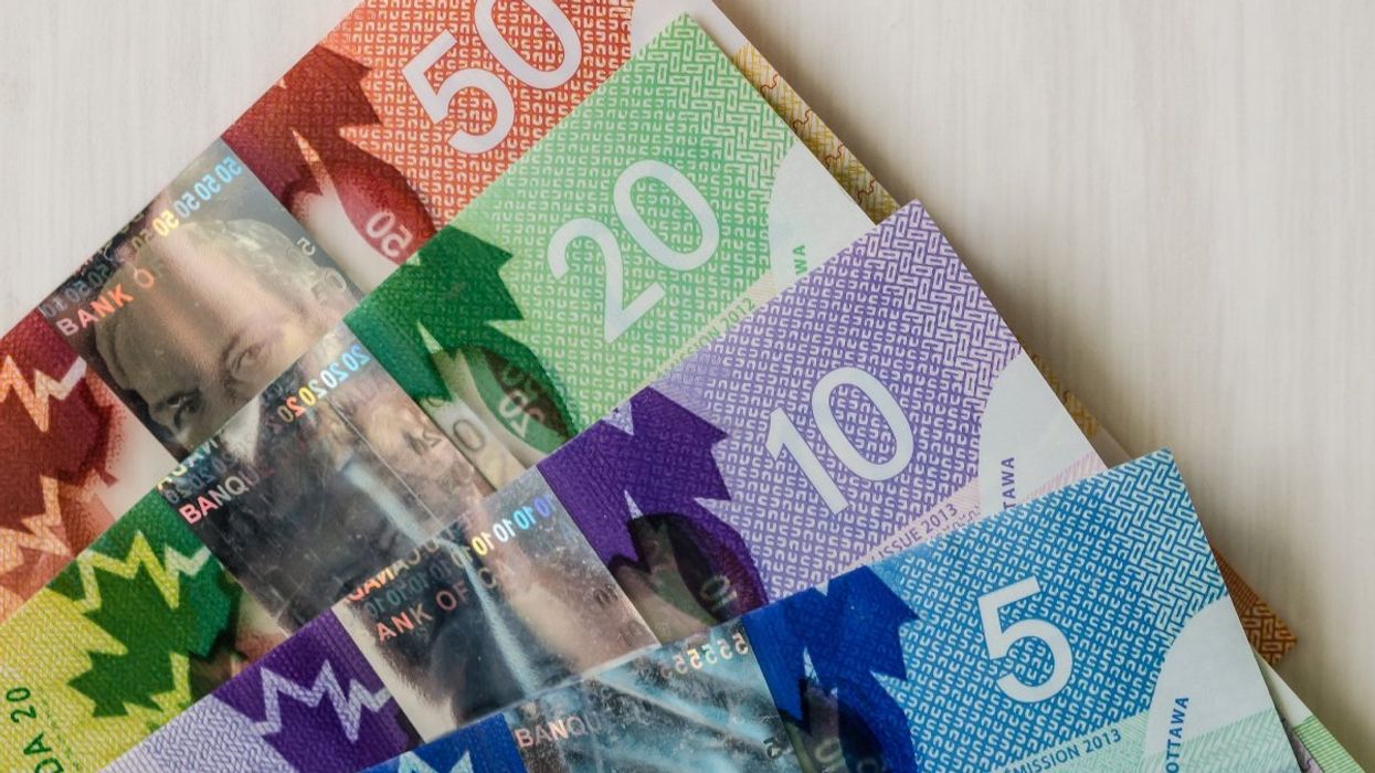 Canadian bank notes including a $50, $20, $10 and $5 bill.
