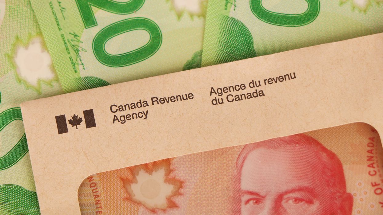 Canadian cash and a CRA envelope (illustrative).