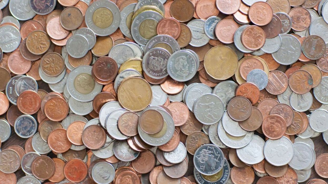 Canadian coins including cents pennies dimes toonies loonies and others.