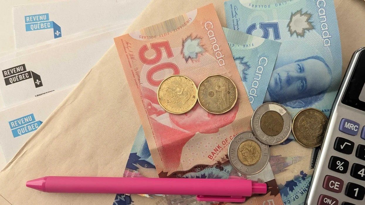 Canadian money and Revenu Québec papers (illustrative).