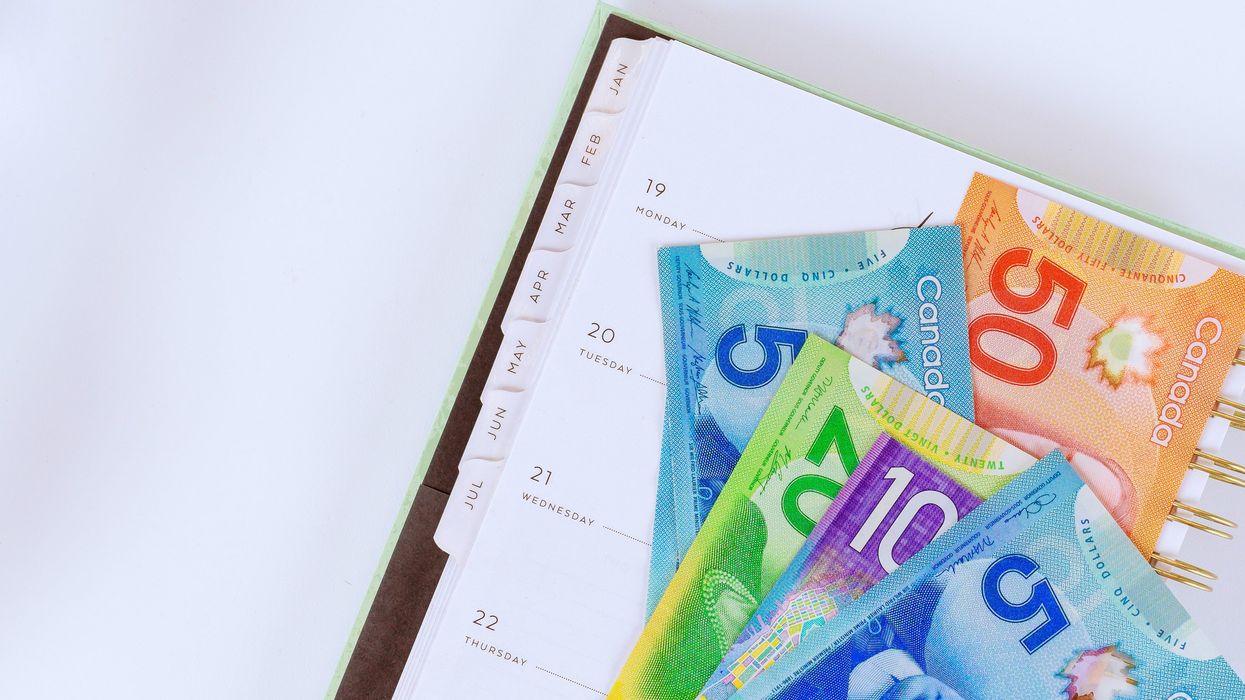 Canadian money on a notebook.