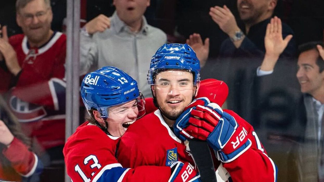 Canadiens players celebrate a goal.