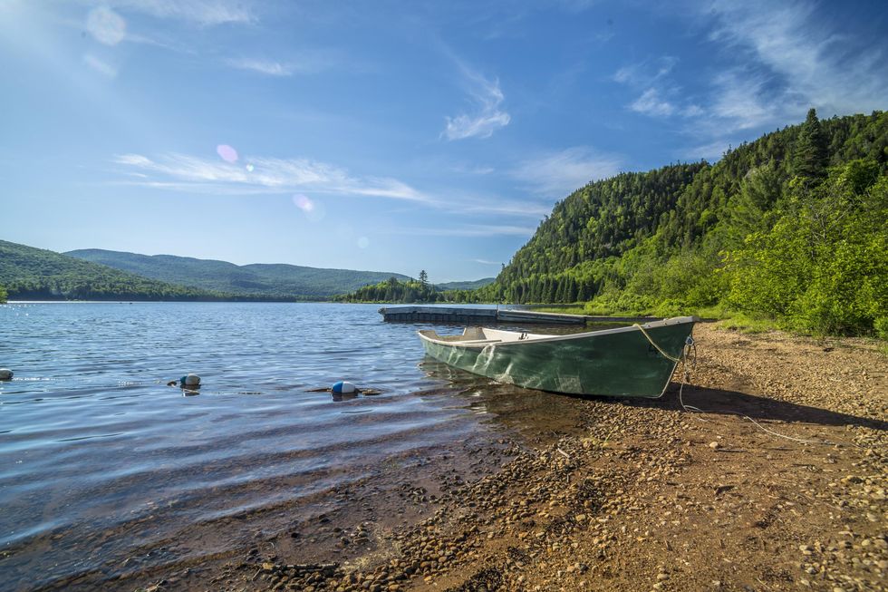Canoe on a beach in the summer.