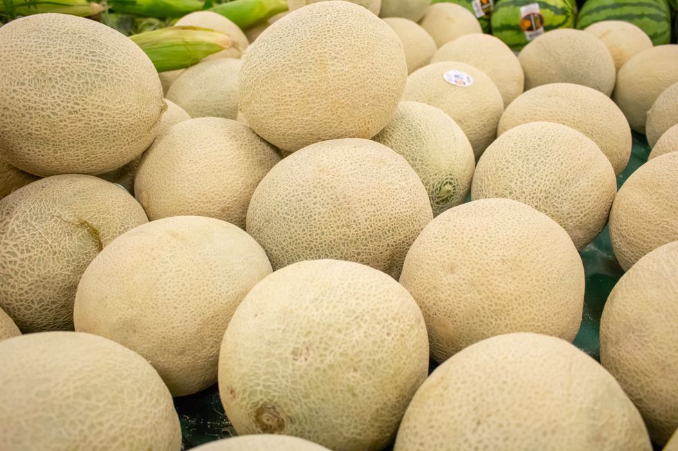 Cantaloupe pile at a grocery store*