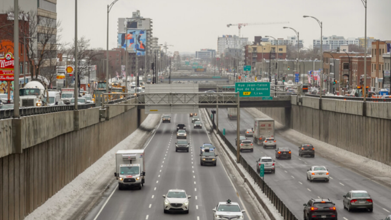 Cars drive along a Montreal highway.