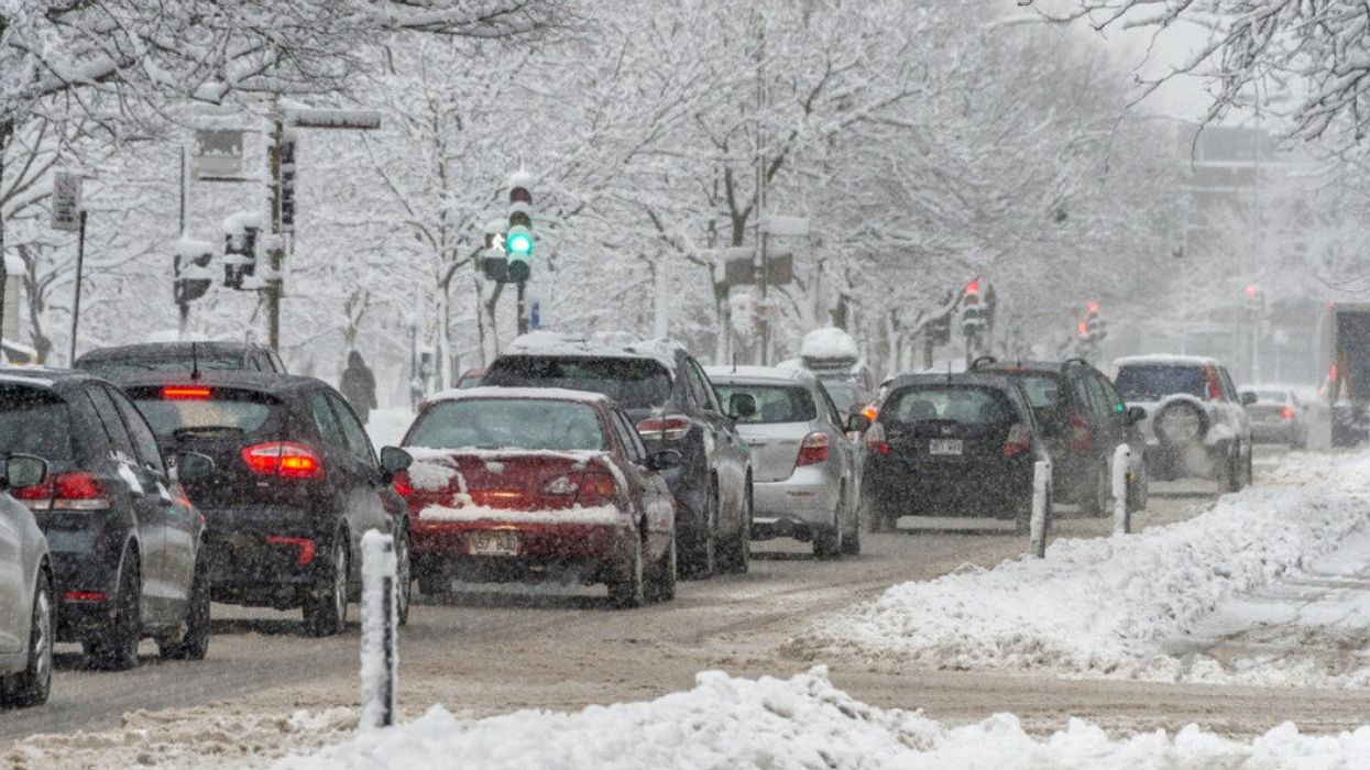 Cars driving in wintery conditions on rue Rachel in Montreal.