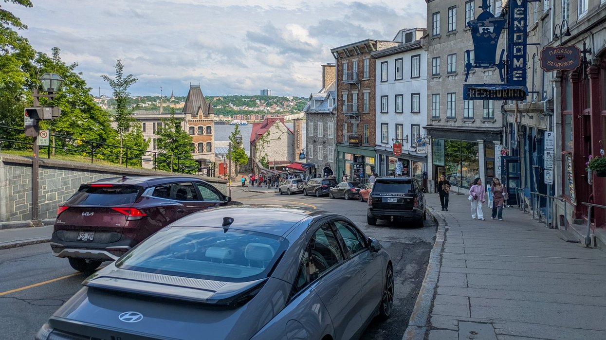 Cars parked along historic street in Old Quebec City.