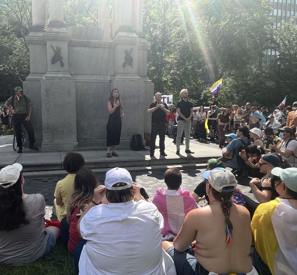 Celeste Trianon, centre, speaks to a crowd at the Place du Canada.