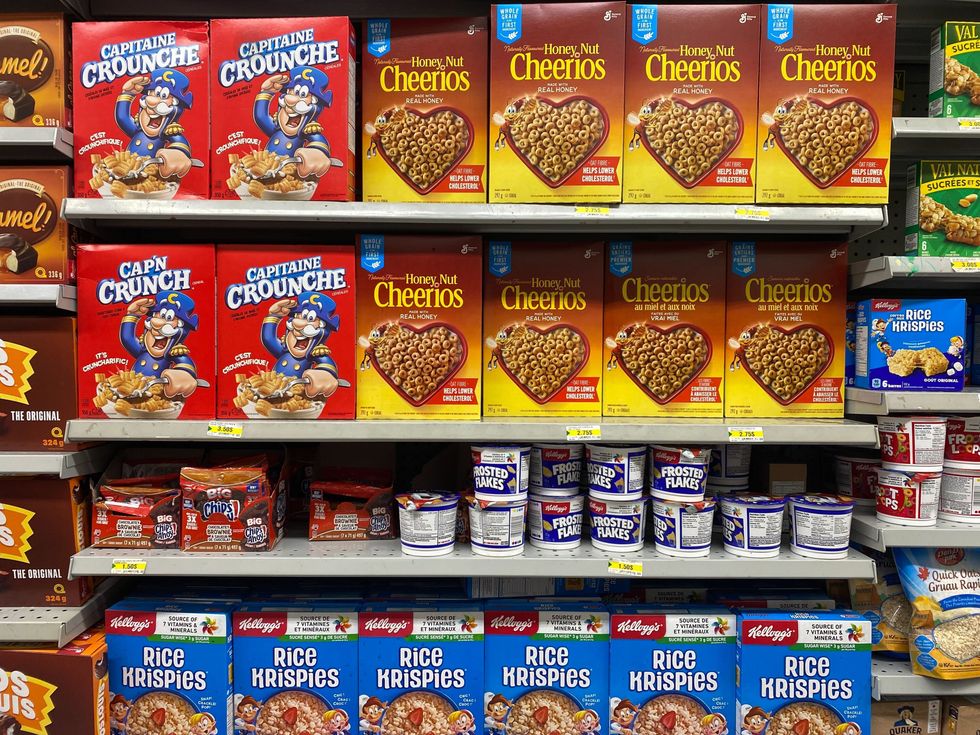 Cereal boxes on a shelf.