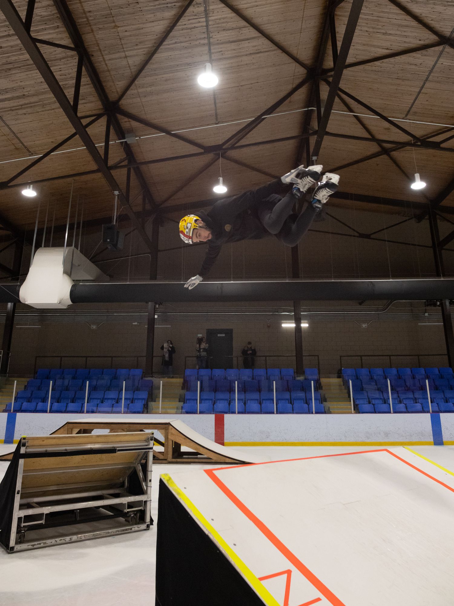 Cirque du Soleil extreme skater Martin Barrau performs a stunt over two ice ramps.