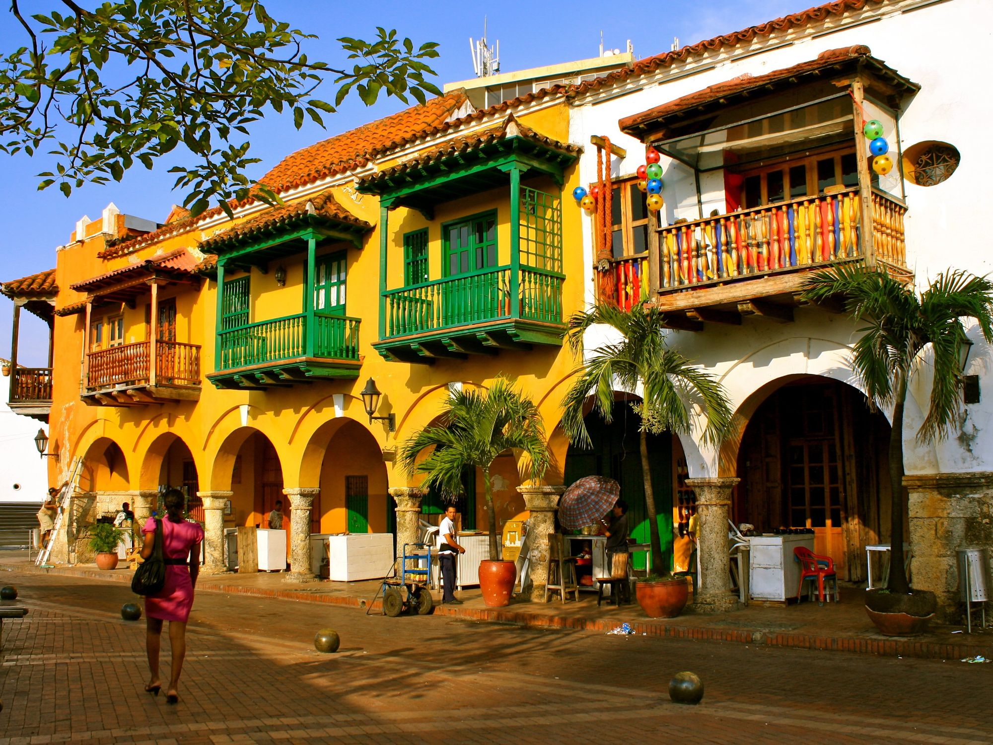 Colonial buildings with wooden balconies at Plaza de los Coches inside the walled city of Cartagena de Indias, Colombia.