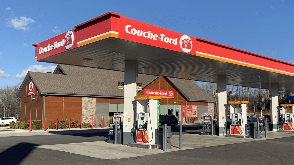 Couche-Tard convenience store and gas station with fuel pumps in Quebec.