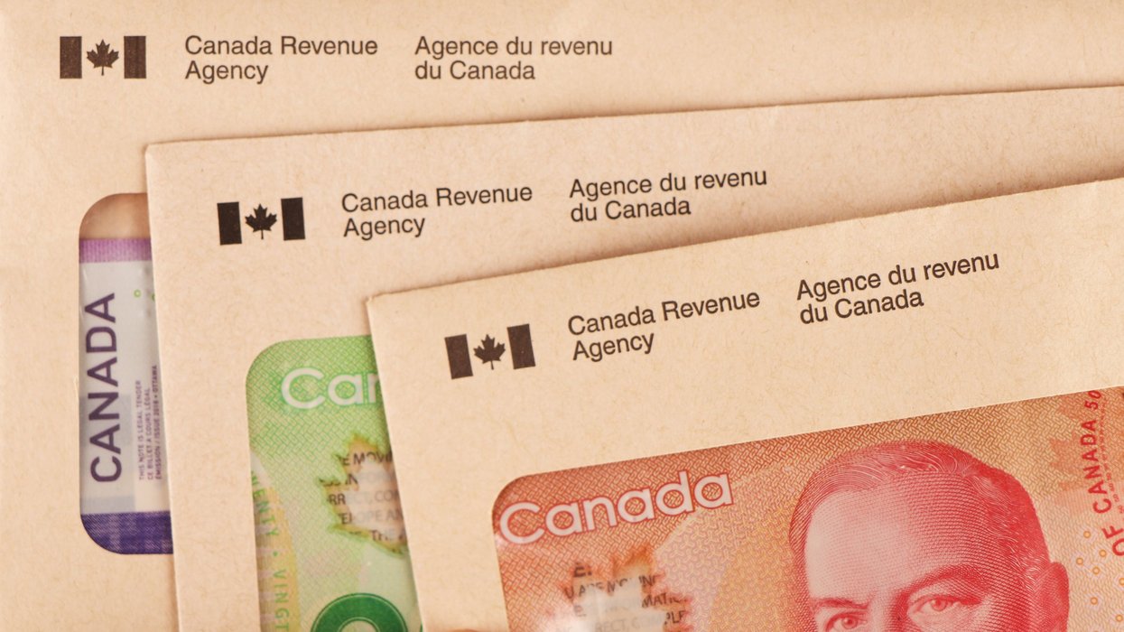 CRA envelopes and Canadian cash (illustrative).