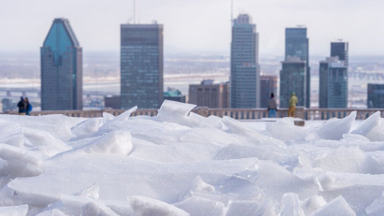 Cracked ice on Mount Royal with the Montreal skyline in the background.