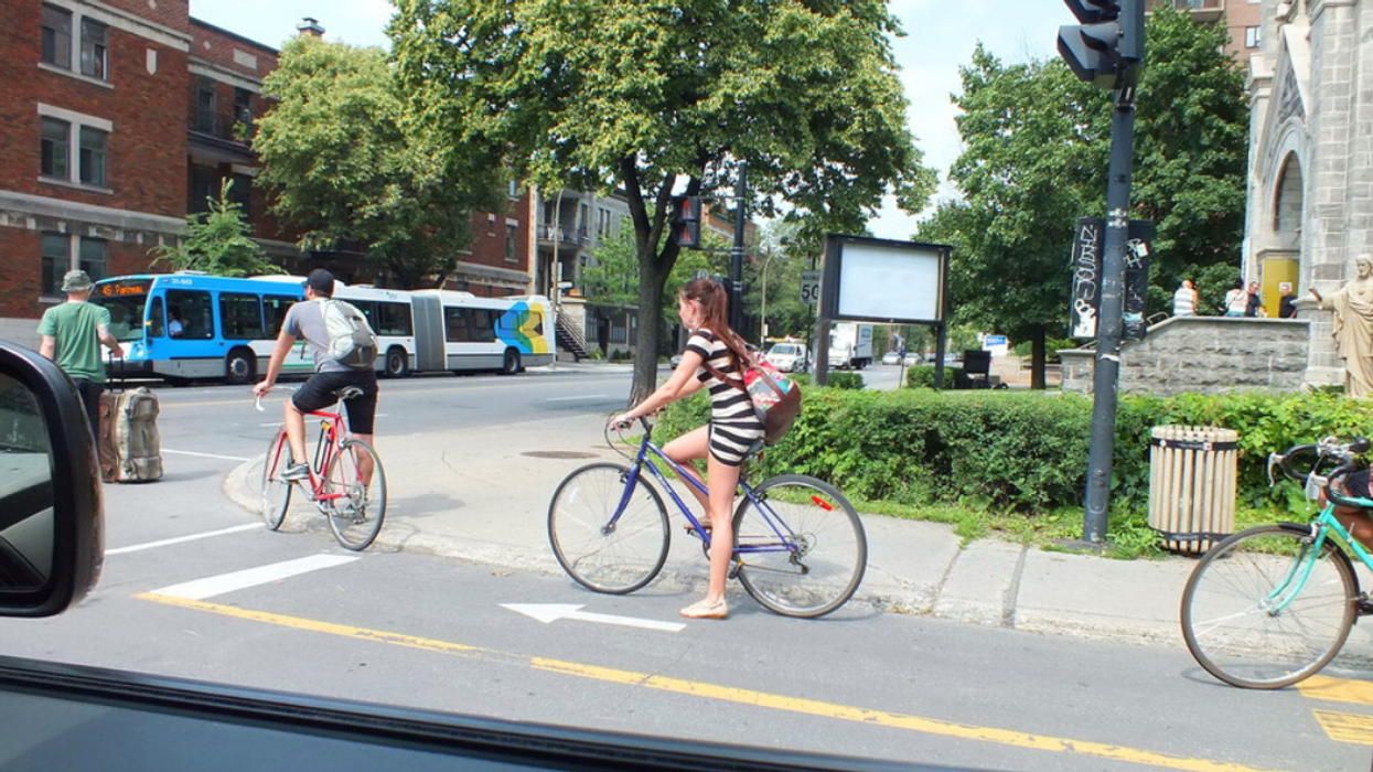 Cyclists ride along a Montreal bike path.