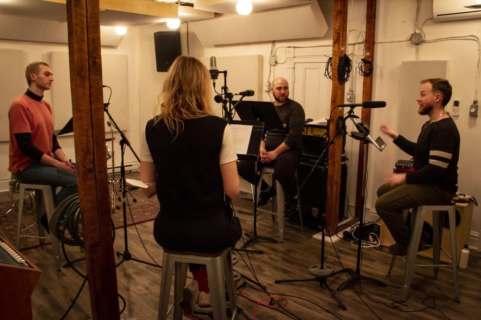 Dane (R) and actors in the studio recording a radio drama version of Daryl's play, Mustang 01.