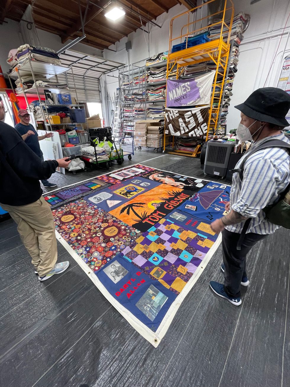 Dane (R) visits the AIDS quilt, specifically Daryl's square, in San Leandro, California.