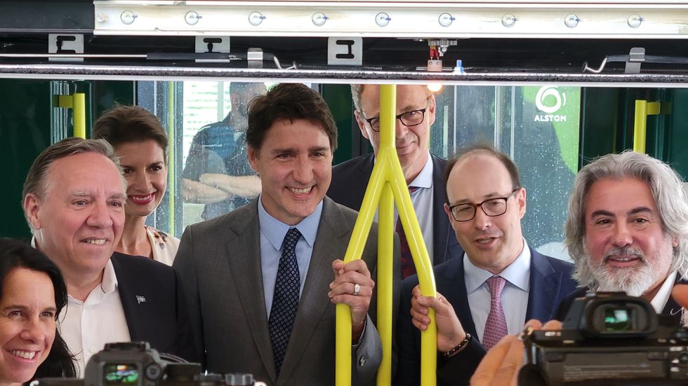 Dignitaries in a REM car.